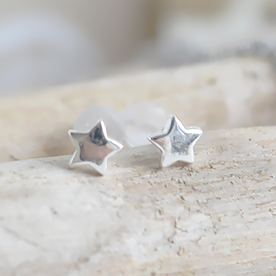 Simple silver star studs inspired by the calm, understated charm of the New England coastal lifestyle.