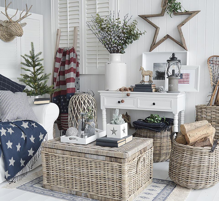 New England decor in a living room full of character in traditional stars and stripes american home interior. Furniture and accessories from The White Lighthouse