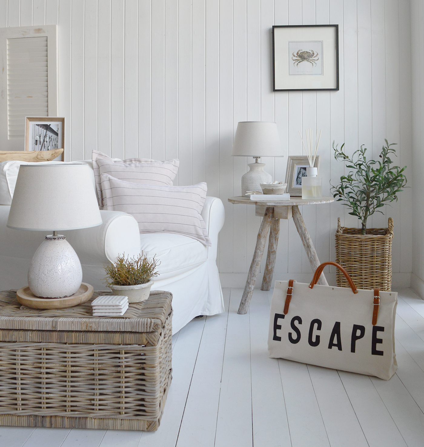 A Hamptons coastal living room with plenty of texture from the natural materials for the vaske and driftwood table. Warmed with the peabody cushion covers