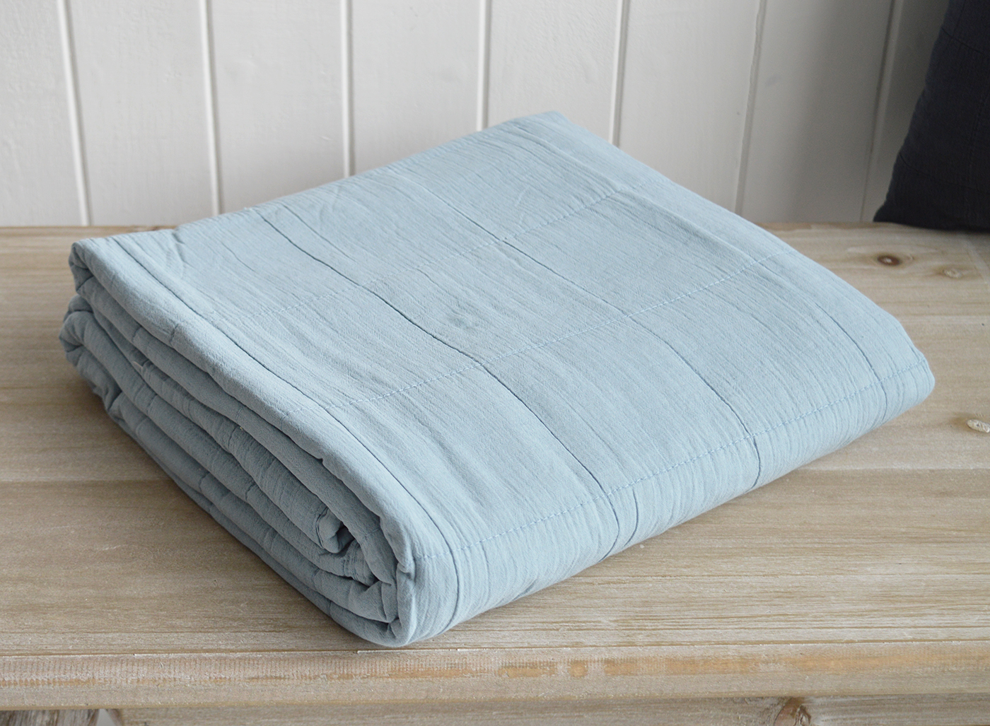 Designed to layer beautifully, these quilts and cushions invite relaxation and warmth.