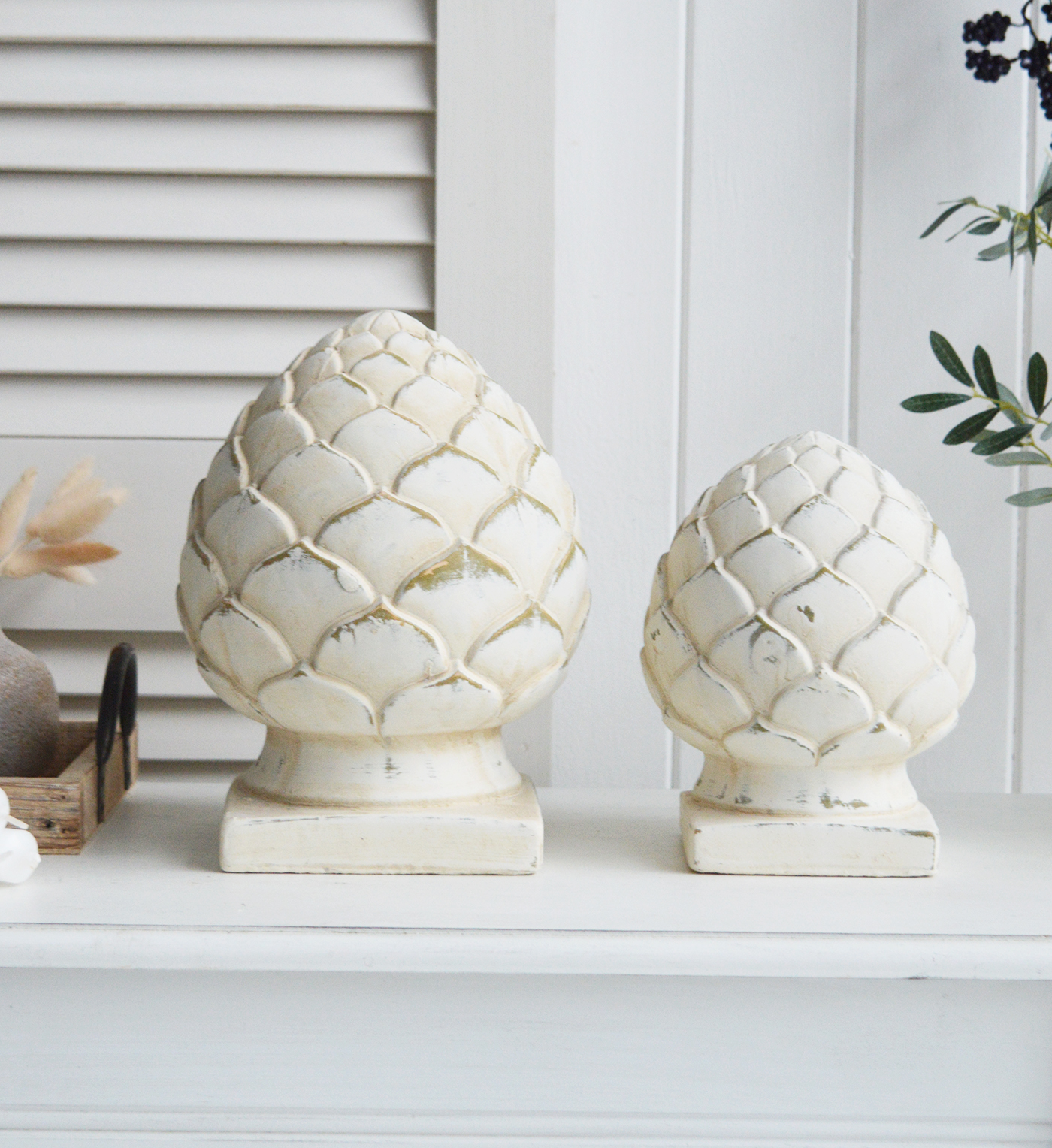 Standing Pinecones in aged cream stone