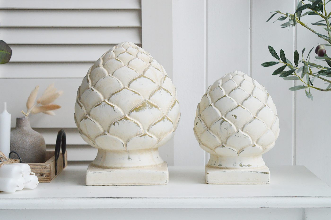 Standing Pinecones in aged cream stone