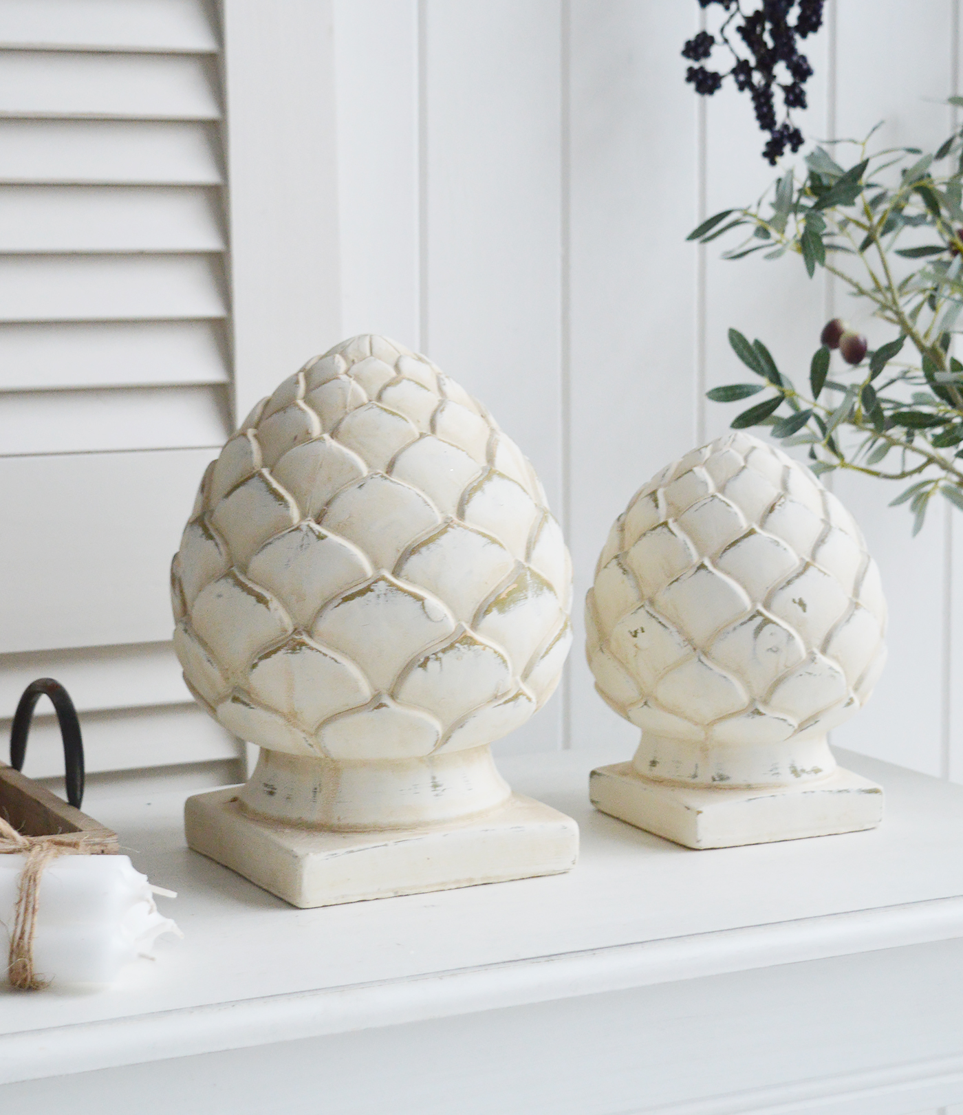 Standing Pinecones in aged cream stone