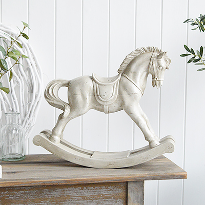 The White Lighthouse. White Furniture and accessories for the home. A decorative cream vintage rocking horse for New England Furniture and Interiors