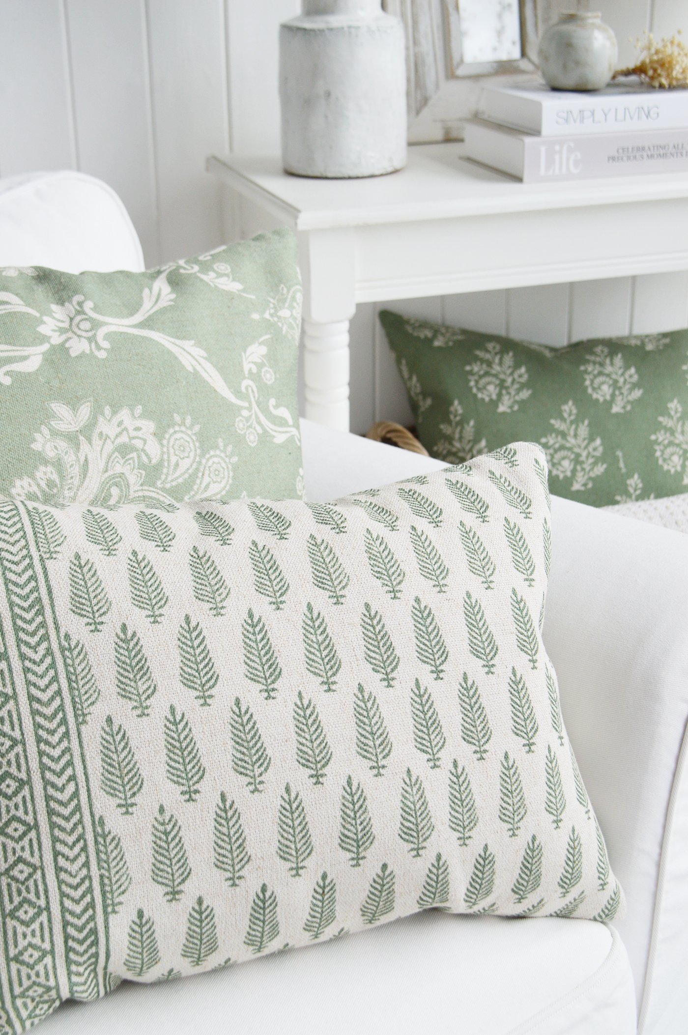 Pattern mixing is one of the easiest ways to add personality and visual interest to a room. By combining complementary prints in soft, nature-inspired tones, this arrangement creates a layered look that feels curated rather than coordinated. The delicate botanical motifs bring a sense of freshness and movement, while the gentle colour palette keeps the overall feel calm, elegant and effortlessly timeless. Perfect for introducing subtle colour and texture without overwhelming a space, these cushions demonstrate how thoughtful styling can transform even the simplest seating area into an inviting focal point.