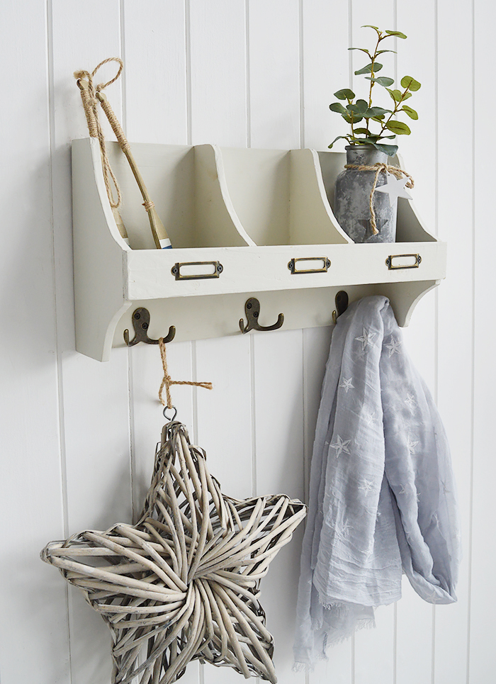 white wooden wall shelf with hooks in beach house aged finish, ideal for hallway as coat storage or in bathroom and bedroom. Photograph to show the side