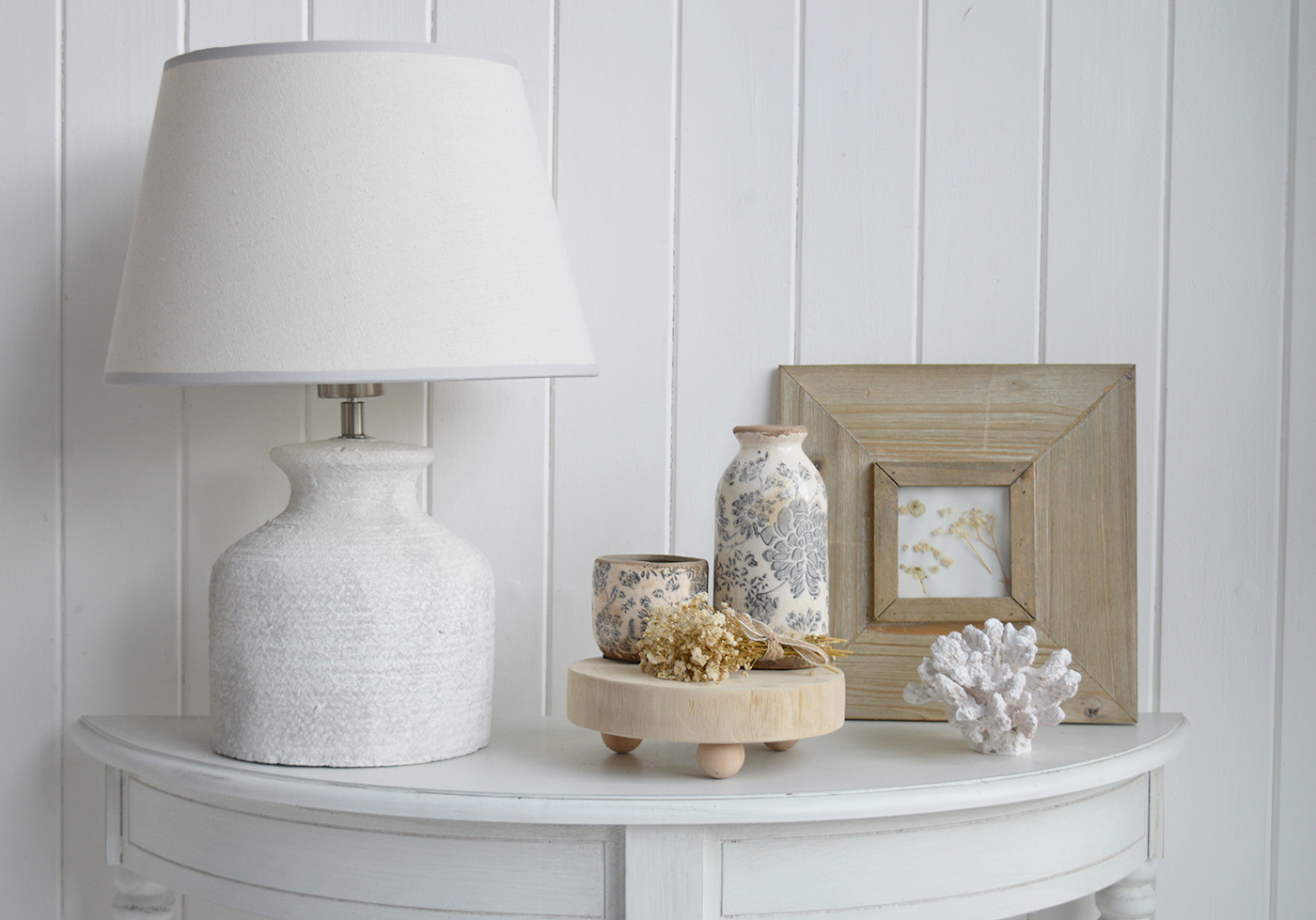 Bring coastal cottage style to your console table with coordinated decorative accessories in soft, muted tones.