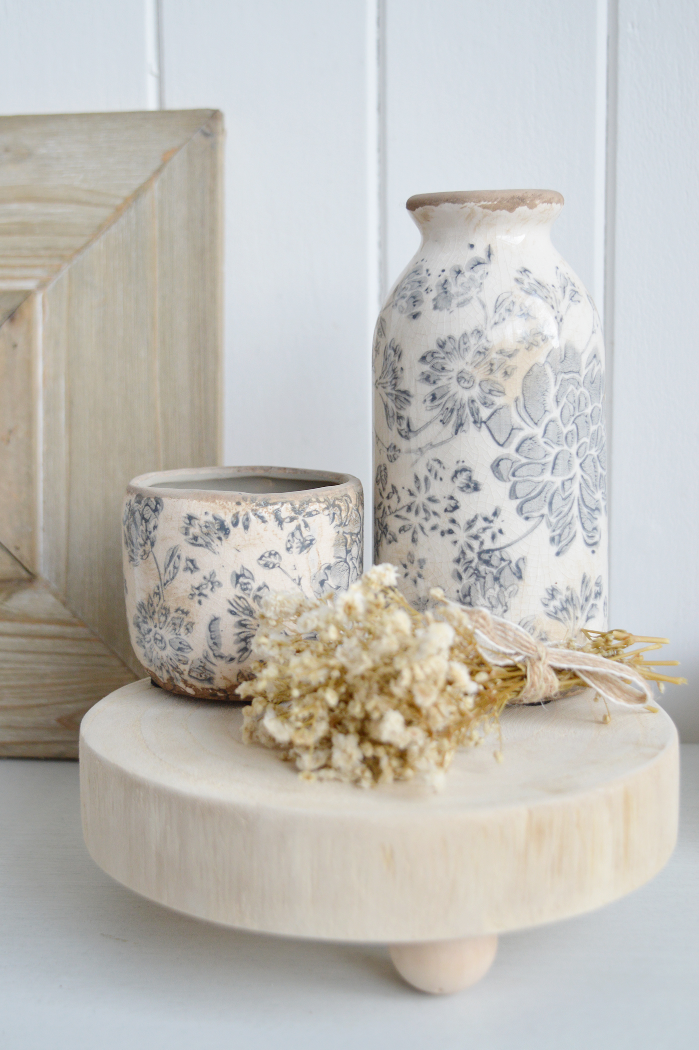 Add texture and delicate botanical pattern to your cottage living room with this four-piece home décor bundle.