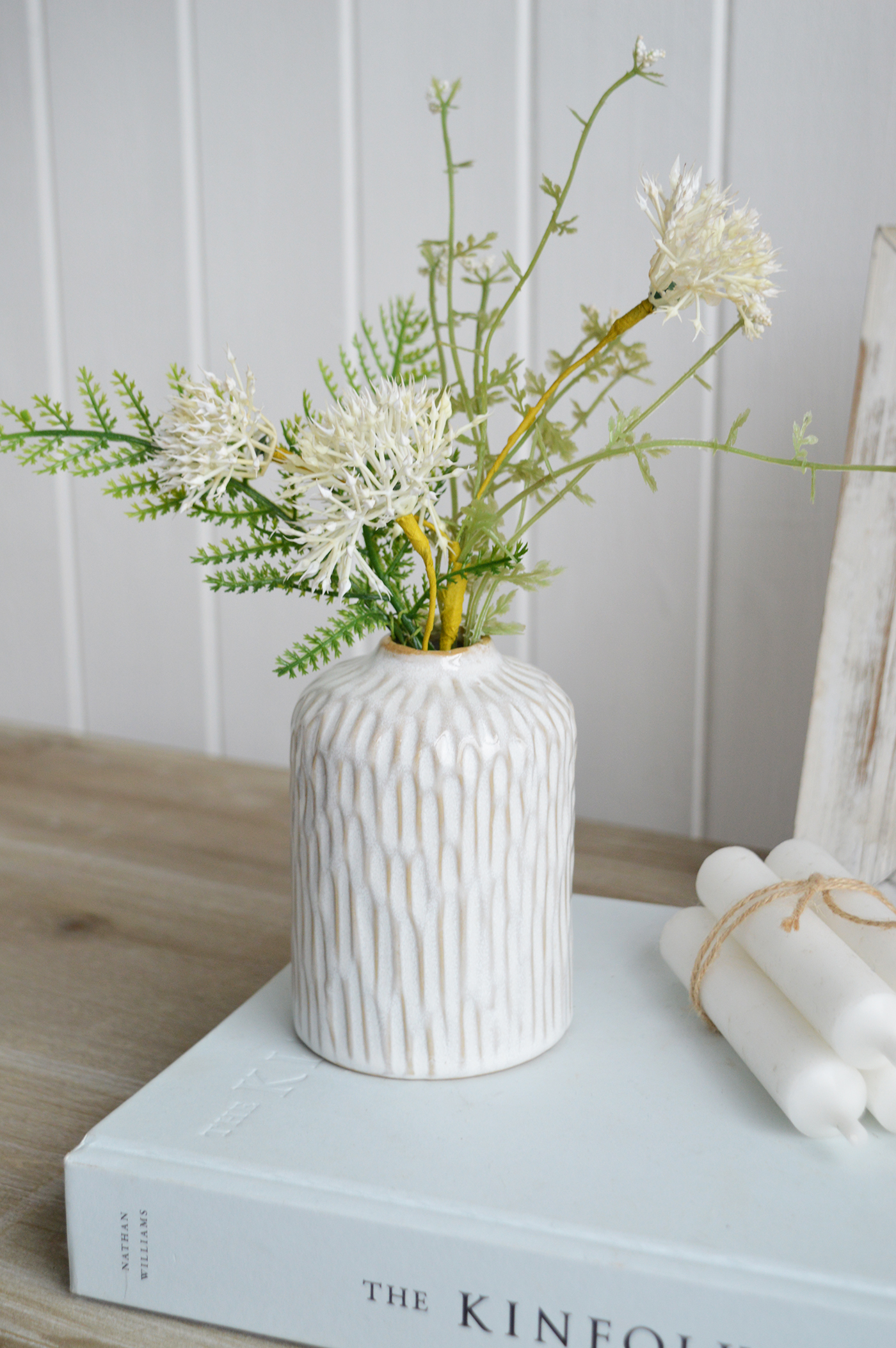 Its wave-like texture and natural simplicity make the Charlotte bud vase an ideal accent for a breezy, seaside-inspired décor.