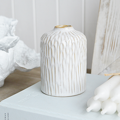 With its soft rippling texture and crisp white finish, the Charlotte ceramic bud vase brings a touch of coastal serenity to any space. Its wave-like texture and natural simplicity make the Charlotte bud vase an ideal accent for a breezy, seaside-inspired décor.