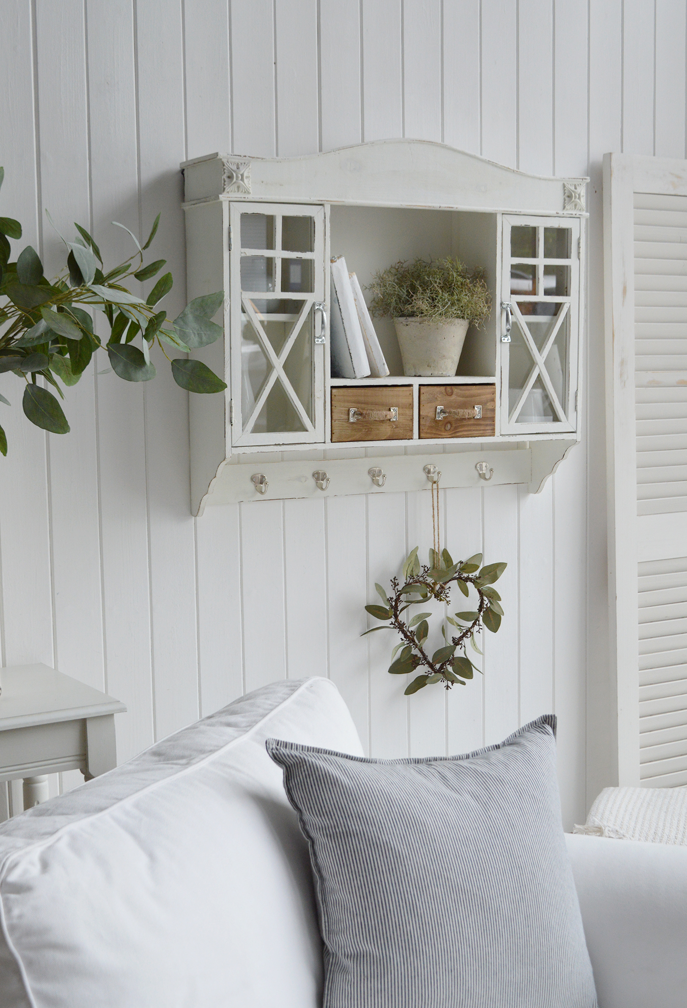 farmhouse style wall cabinet with glass doors and wood drawers