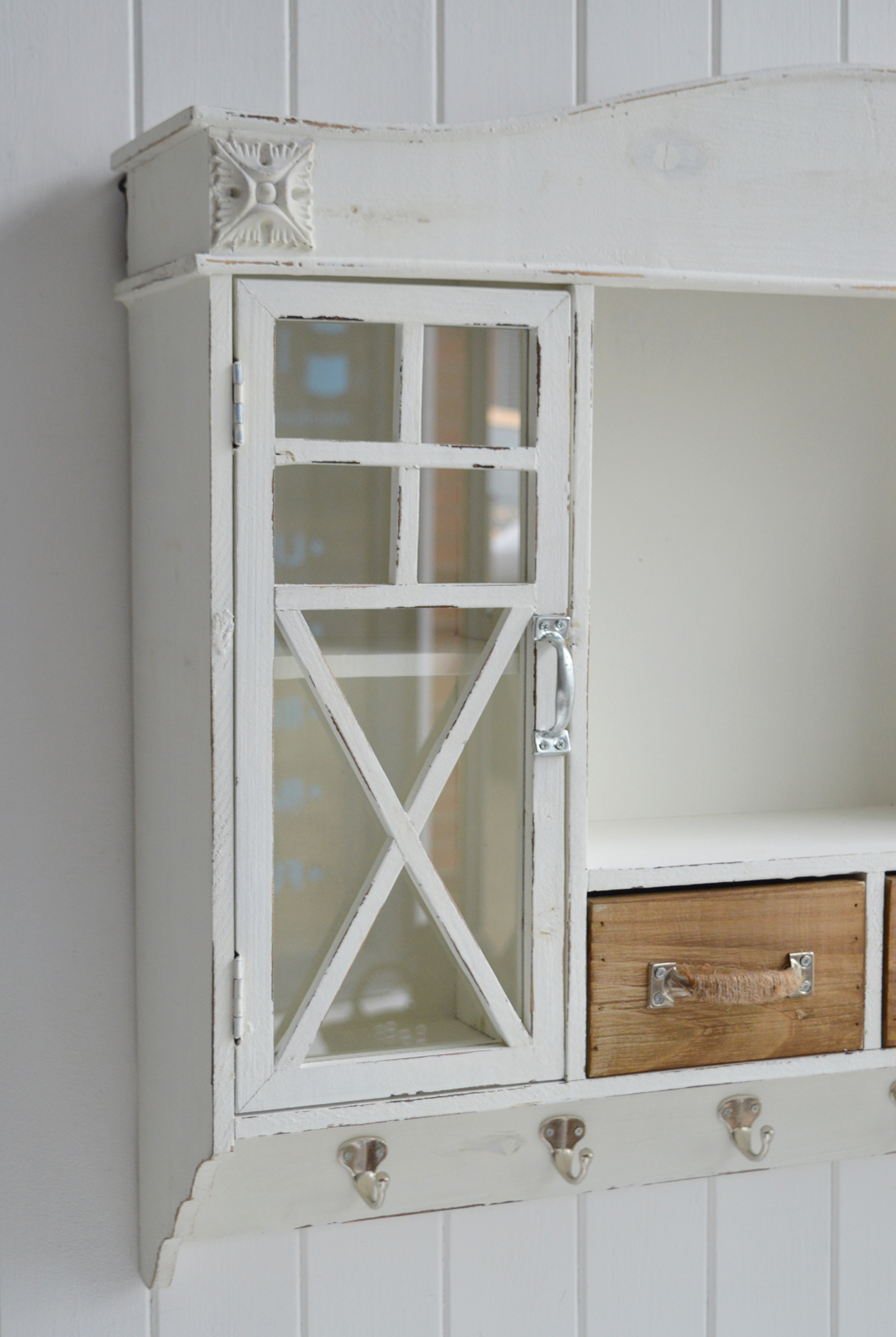 rustic cottage wall cabinet with drawers and coat hooks