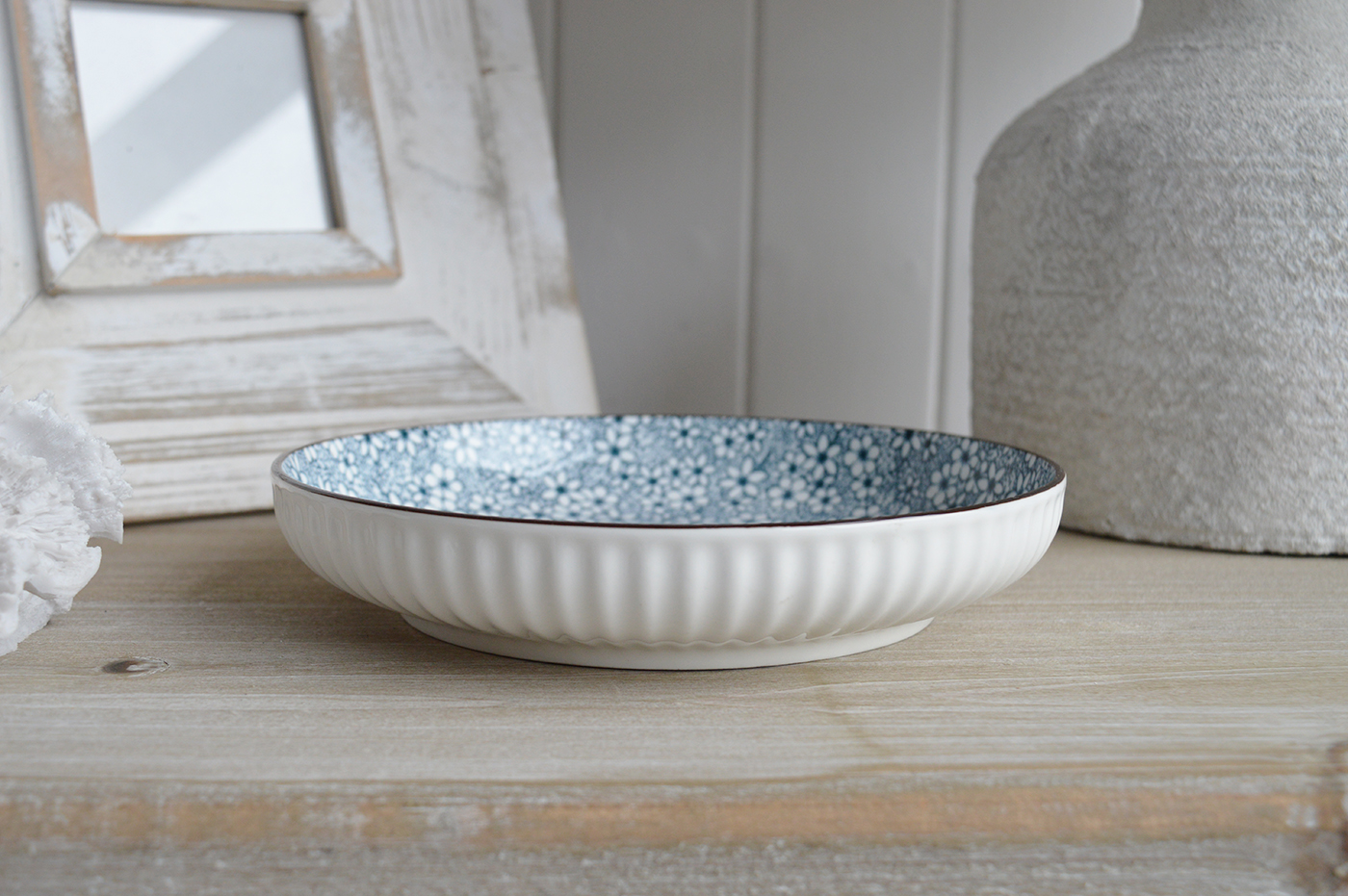 Inspired by garden blooms and breezy coastal charm, each piece evokes the serenity of the countryside.