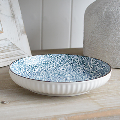 The Willowridge ceramic bowl blends classic blue and white florals with elegant white ribbed edging for a timeless New England look. Inspired by garden blooms and breezy coastal charm, each piece evokes the serenity of the countryside.">