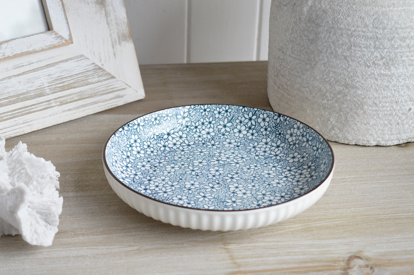 The Willowridge collection blends classic blue and white florals with elegant white ribbed edging for a timeless New England look.