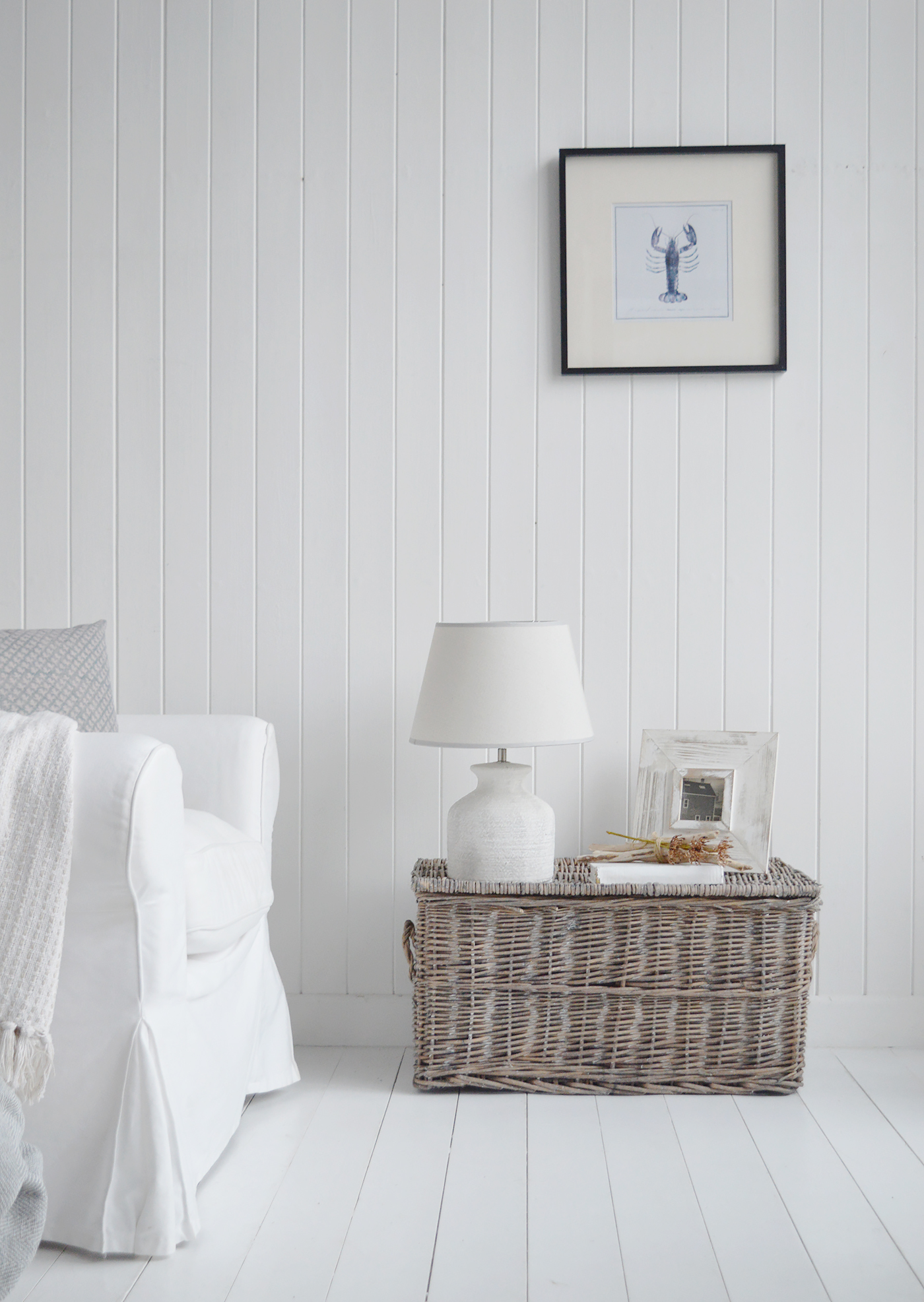 Styled open, the trunk reveals generous storage for throws and pillows, blending seamlessly into relaxed New England cottage living.