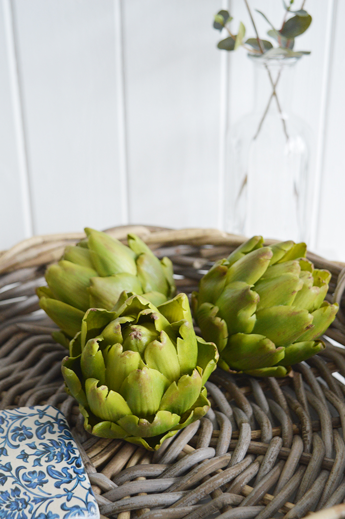 A very realistic decorative artichoke in vibrant green... Looks stunning in a bowl or dish on the kitchen countertop