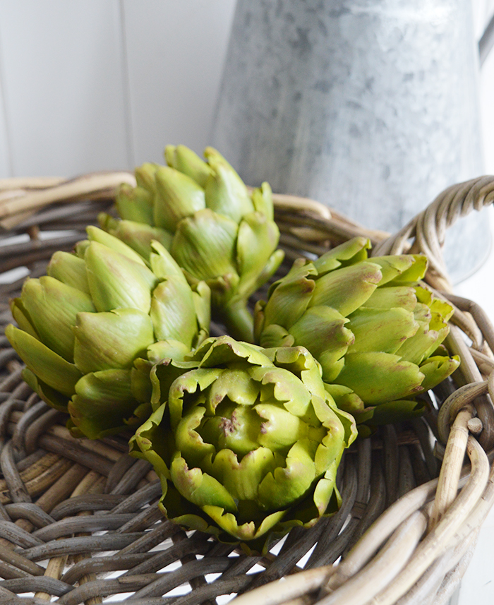 A very realistic decorative artichoke in vibrant green... Looks stunning in a bowl or dish on the kitchen countertop