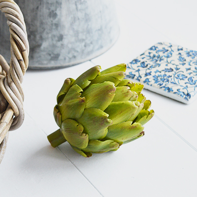 A very realistic decorative artichoke in vibrant green... Looks stunning in a bowl or dish on the kitchen countertop