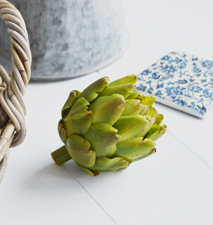 A very realistic decorative artichoke in vibrant green... Looks stunning in a bowl or dish on the kitchen countertop