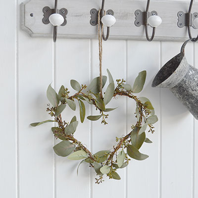 A very realistic, natural and beautiful looking Eucalyptus heart wreath with twigs for adding greenery to your home. 							  Ideal as a centre piece on a table or can be hung from a wall.