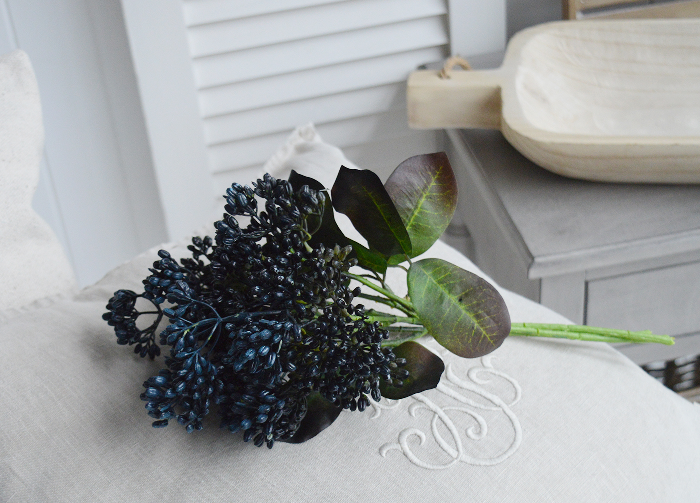 White Furniture and accessories for the home. Artificial greenery Devils Walking Stick. Blue Purplish berries on greenery. New England coastal and country interiors