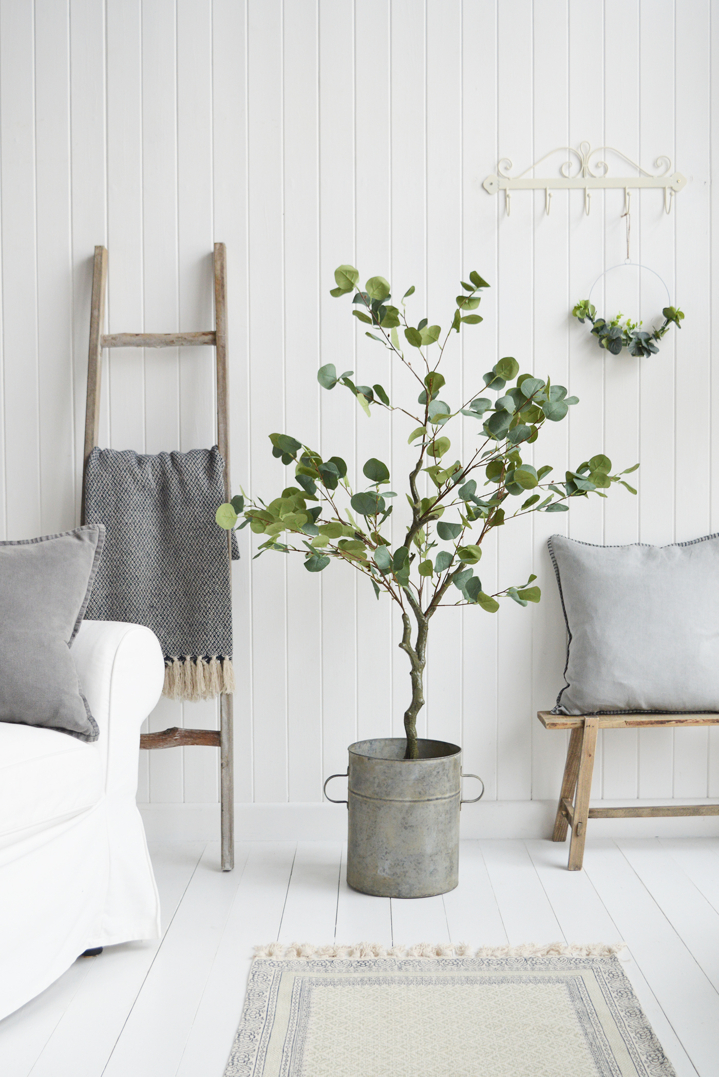 The Easton Rack along with the Hanging Eucalyptus wreath and tree in a white New England living room