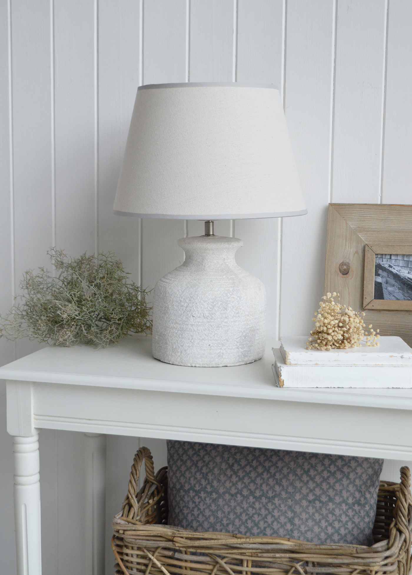 The Barnstead Lamp brings a refined New England charm to any room with its textured stone base and soft, natural fabric shade.
