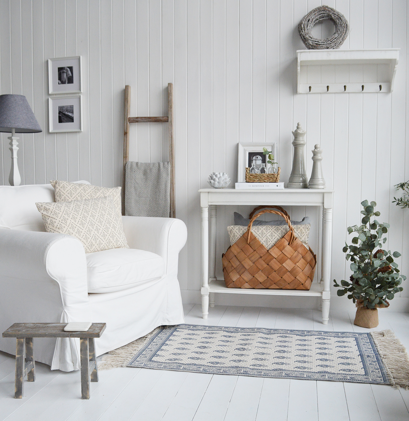 New England style white living room with white furniture