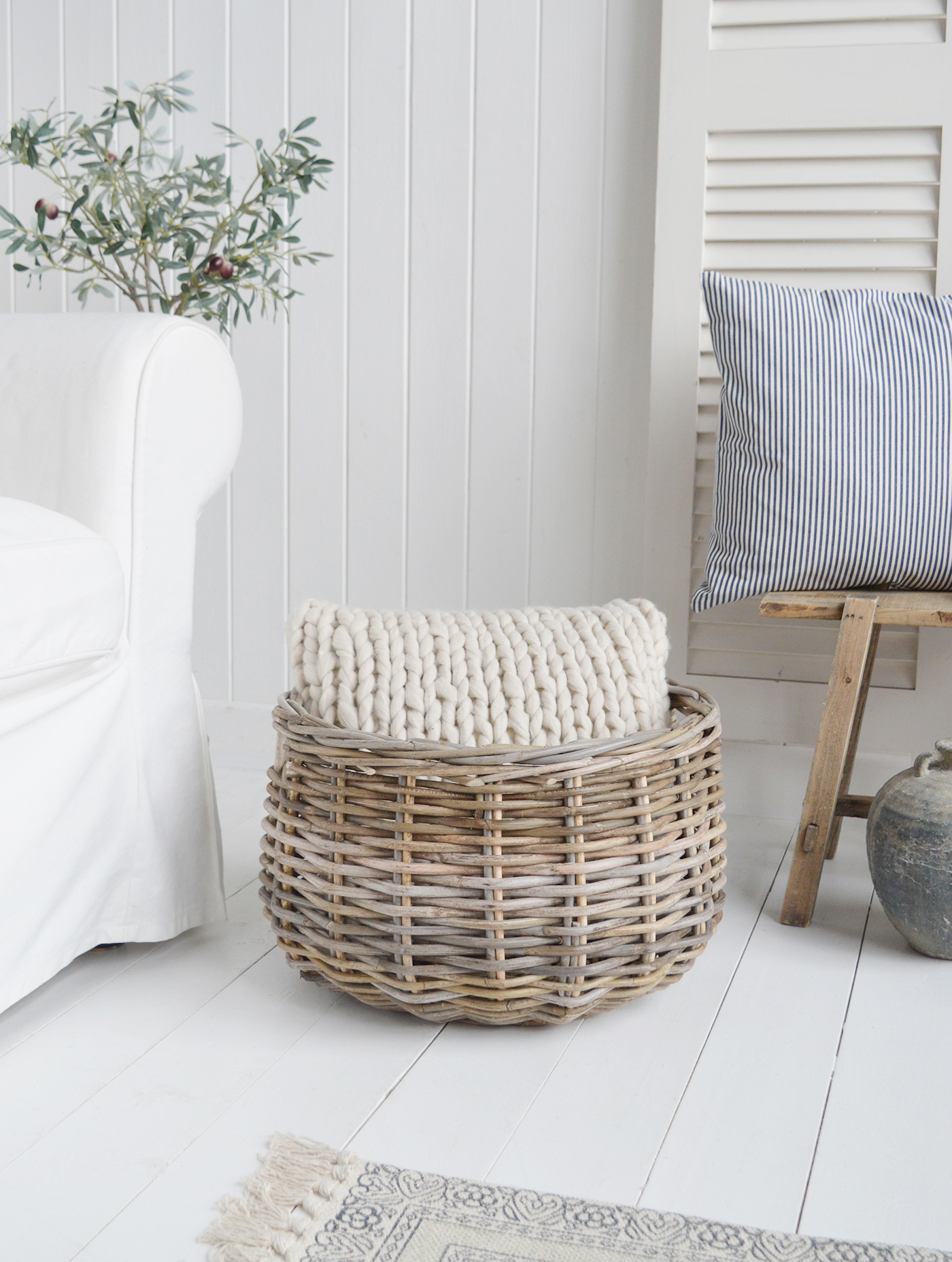 Casco Bay round log basket with chunky knit Mayfair cushion