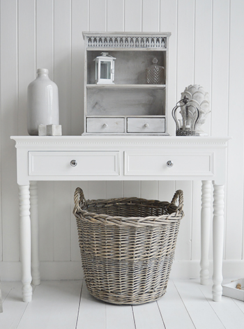 Grey round storage basket with handles, ideal for shoe storage under console in hall