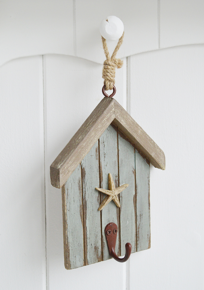 The White Lighthouse. White Furniture and accessories for the home. Three beach hut hooks in rustic weather beaten paint in coastal colours, each with a starfish and painted hook hanging on cord. Decor designed to perfectly complement our New England Coastal and Country home interiors with our bedroom, living room and hallway white furniture