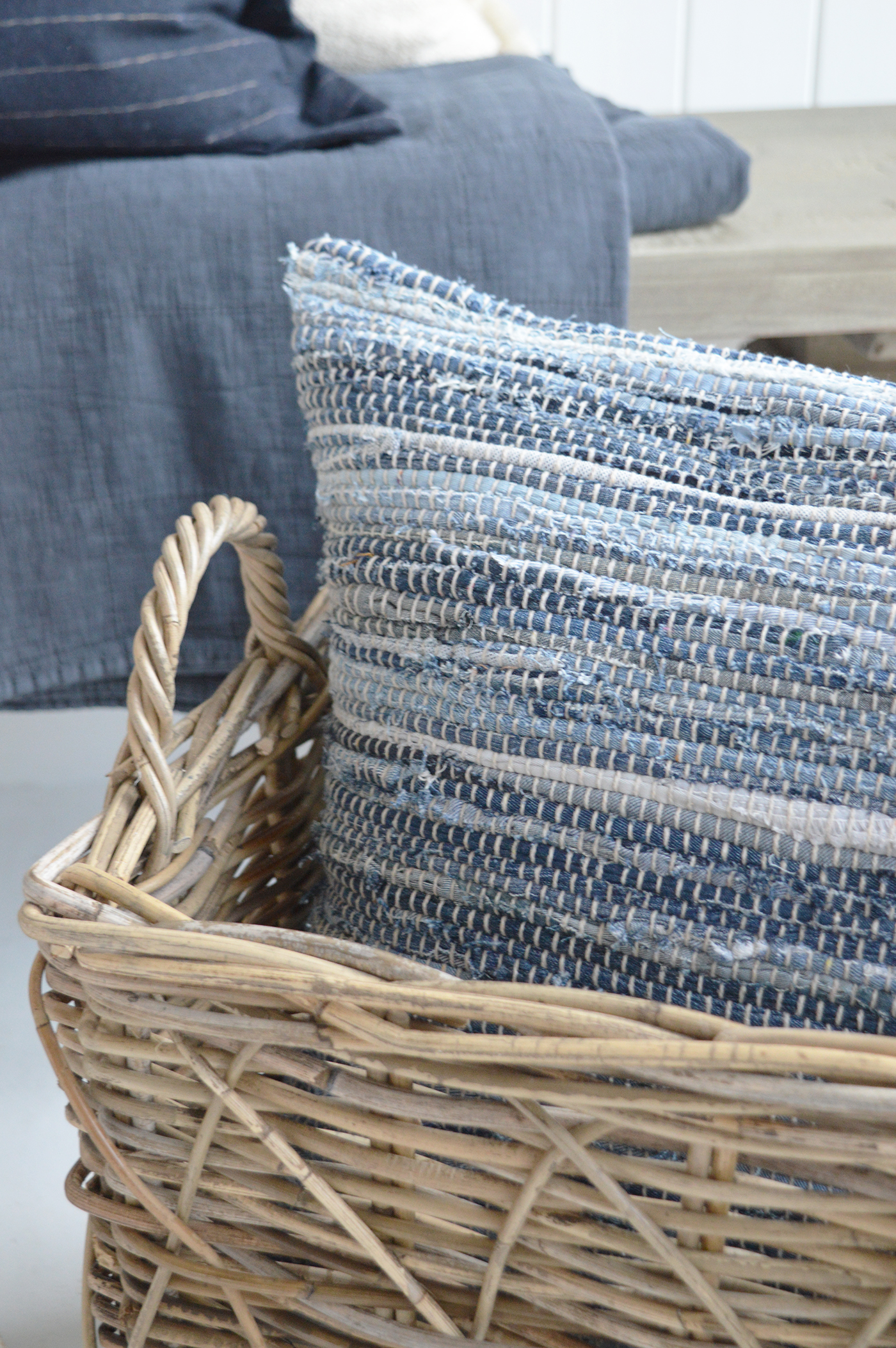 Different textures with the Seascape cushion and natural baskets