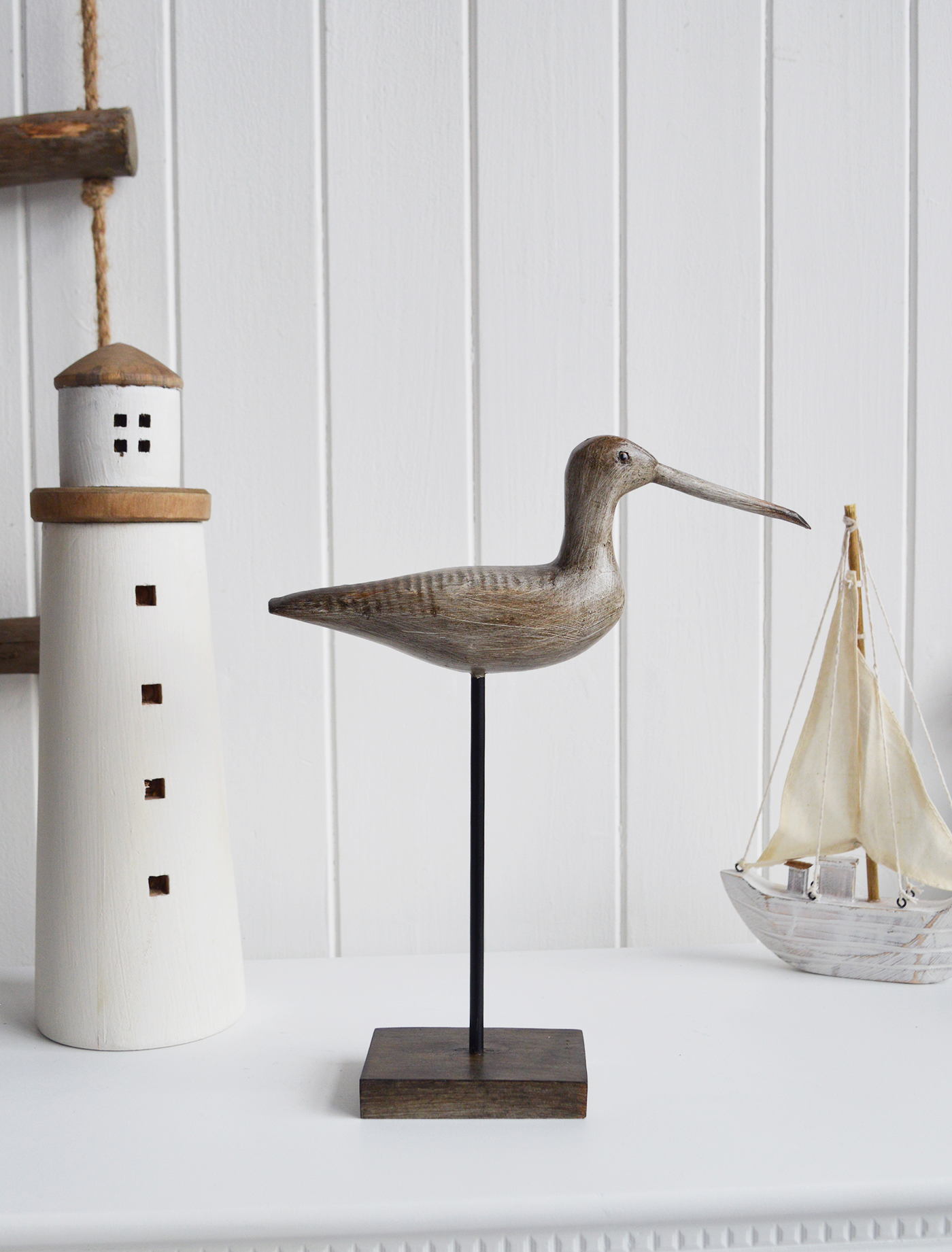 Nautical New England Coastal  Furniture and accessories for the home. A decorative standing seabird from the White Lighthouse Furniture and Home interiors