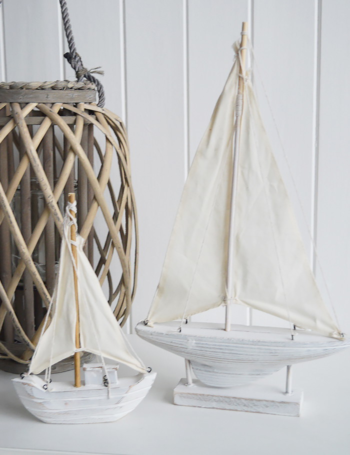 A decorative white yacht sailing boat - Nautical Coastal Home