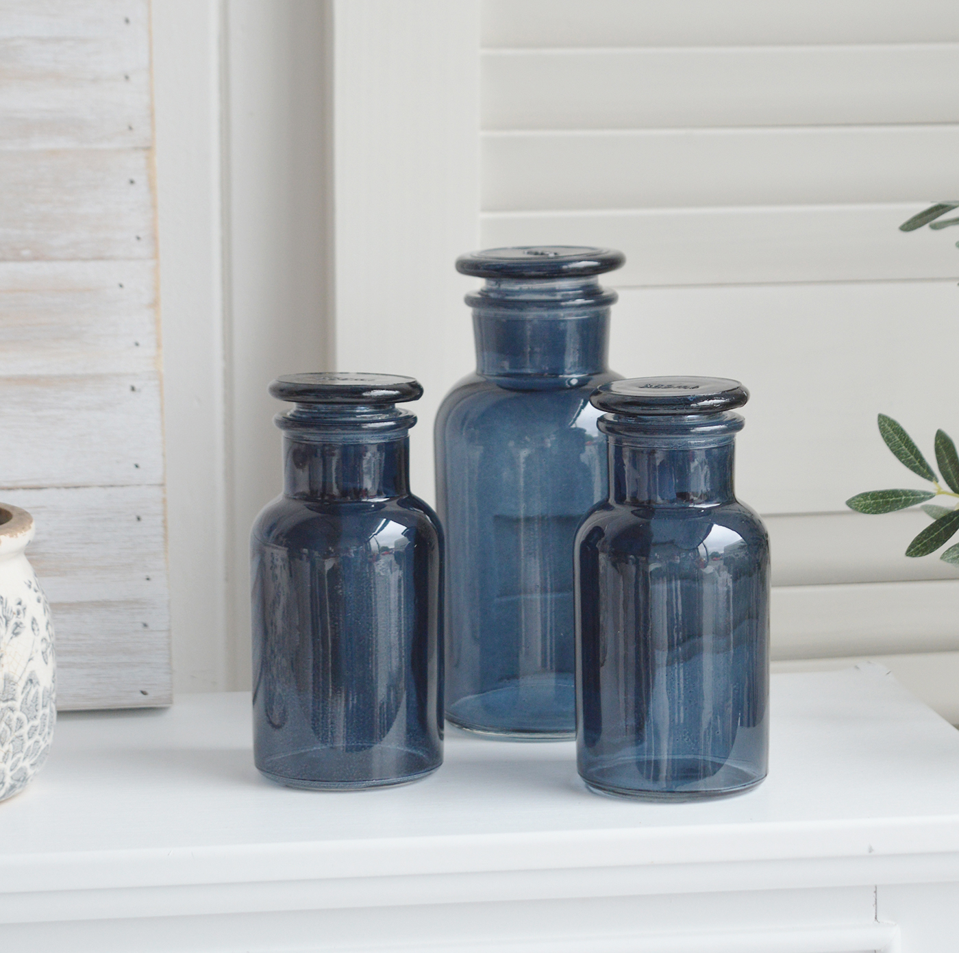 Decorative blue glass bottle with stopper from The White Lighthouse New England furniture and home accessories for country, coastal and city homes and iteriors