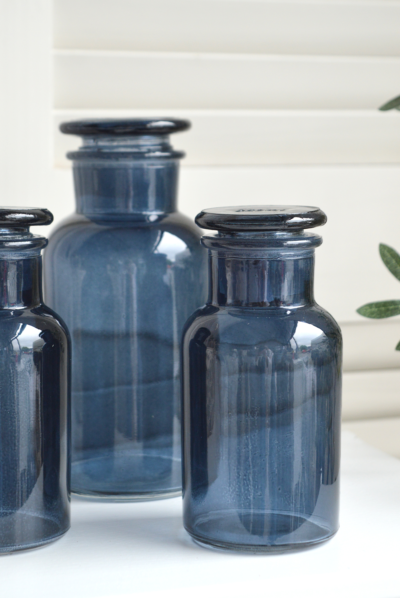 Decorative blue glass bottle with stopper from The White Lighthouse New England furniture and home accessories for country, coastal and city homes and iteriors