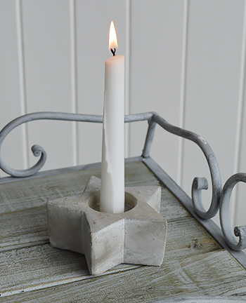 Grey star candle holder on Grayswood table