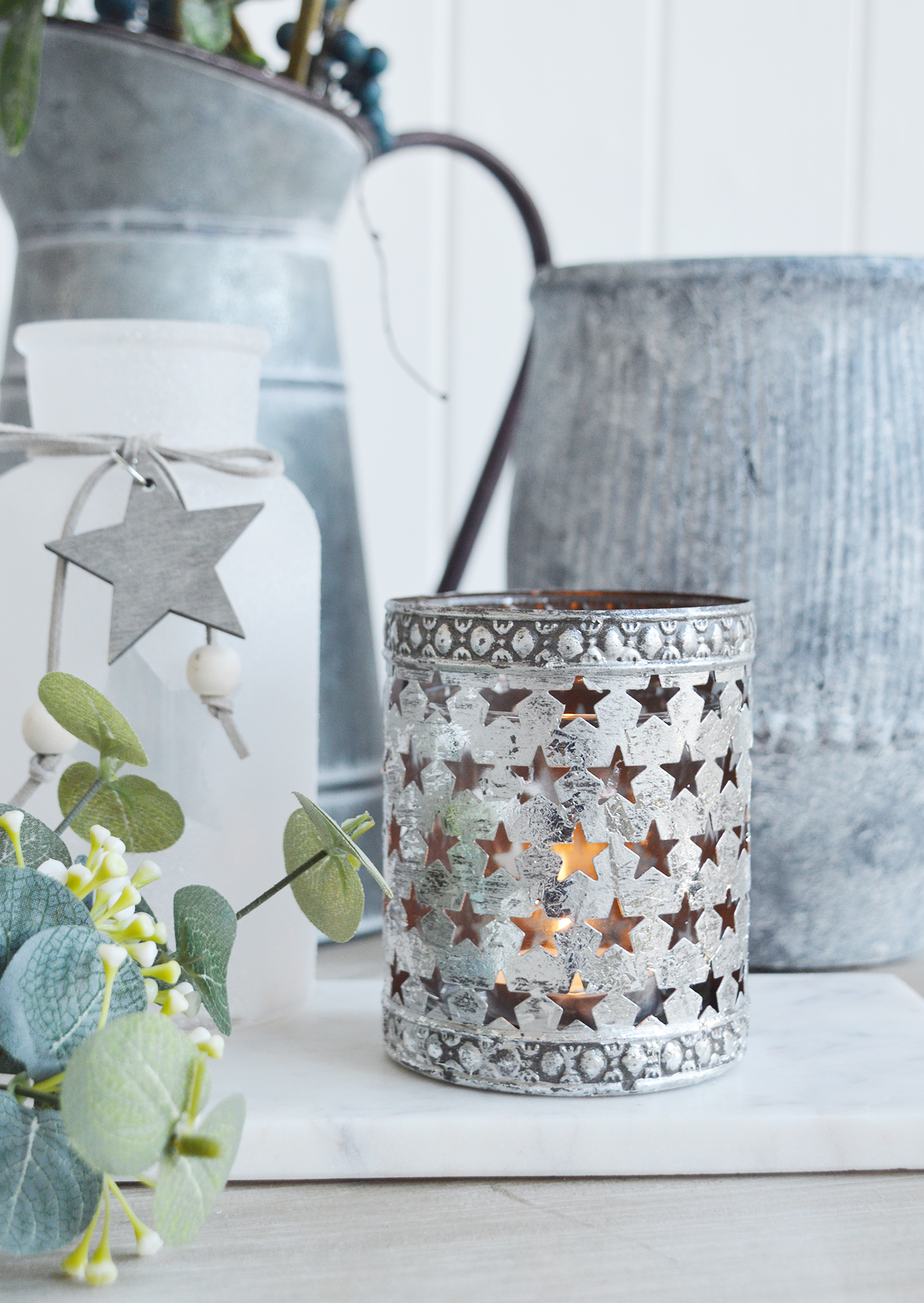 A star candle holder from The White Lighthouse furniture and accessories. New England style home decoor and accessories for coastal, country and city home interiors
