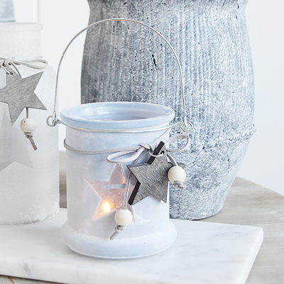 	Our grey etched glass candle hanging lantern holder with star and hanging wooden starThe range of candle holders in grey and white are a perfect accompaniment to our New England, country and coastal furniture for your bedroom, living room, hall and bathroom.