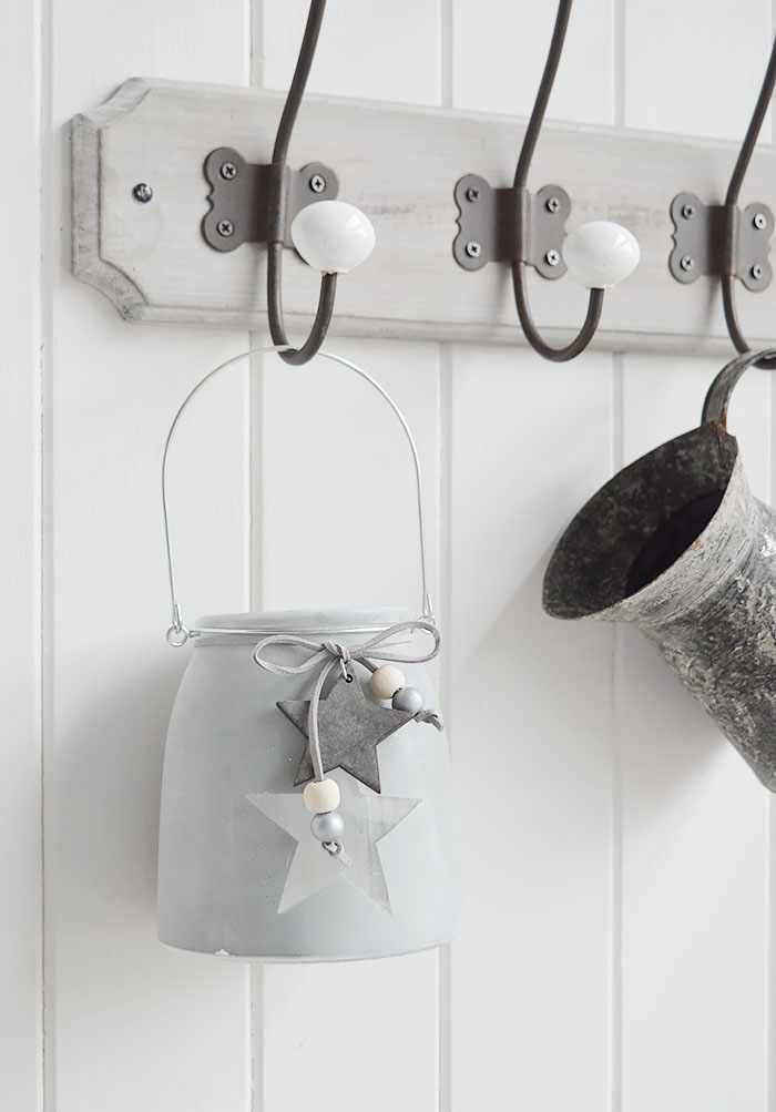 	Our grey etched glass candle hanging lantern holder with star and hanging wooden star
The range of candle holders in grey and white are a perfect accompaniment to our New England, country and coastal furniture for your bedroom, living room, hall and bathroom.