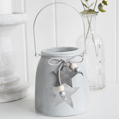 	Our grey etched glass candle hanging lantern holder with star and hanging wooden starThe range of candle holders in grey and white are a perfect accompaniment to our New England, country and coastal furniture for your bedroom, living room, hall and bathroom.