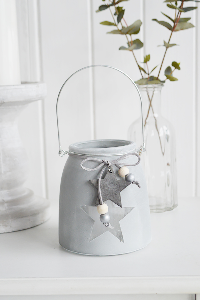 	Our grey etched glass candle hanging lantern holder with star and hanging wooden starThe range of candle holders in grey and white are a perfect accompaniment to our New England, country and coastal furniture for your bedroom, living room, hall and bathroom.
