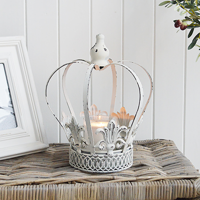 A vintage white crown candle holder