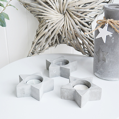 A set of 3 star tea light holders in grey stone.

On a dining table, shelf or console, these are a gorgeous way to create a relaxing ambience.