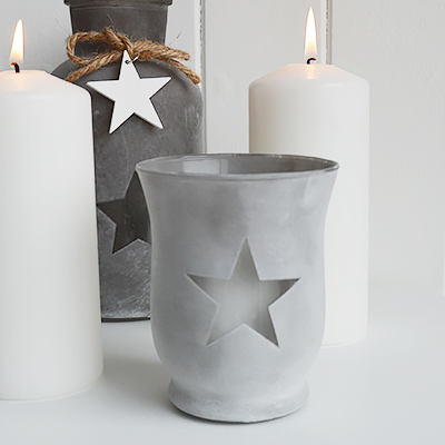 	Our grey etched glass candle hanging lantern holder with star and hanging wooden starThe range of candle holders in grey and white are a perfect accompaniment to our New England, country and coastal furniture for your bedroom, living room, hall and bathroom.