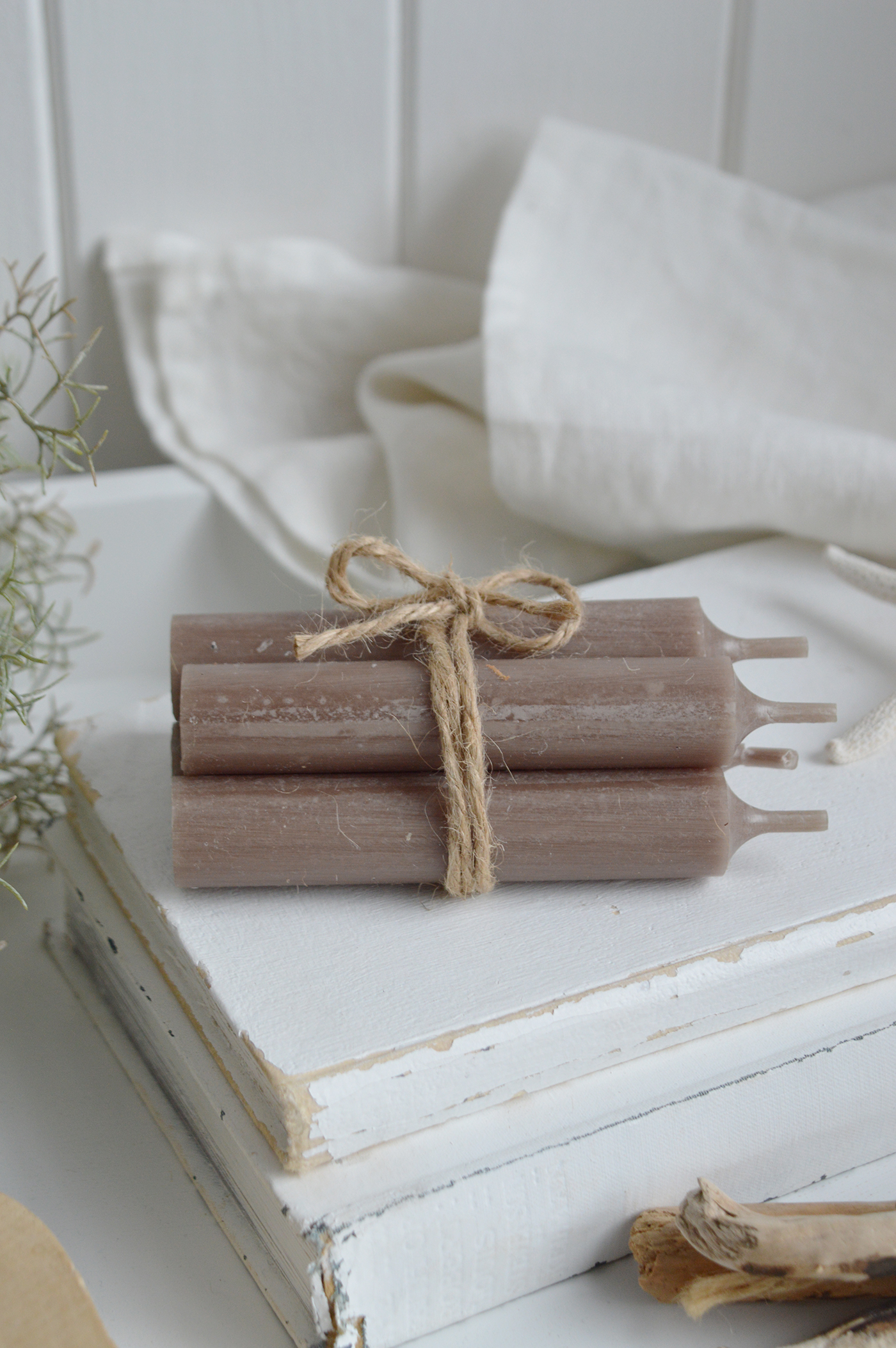 Taupe bundel of candles for simple styling of neutral coastal interiors
