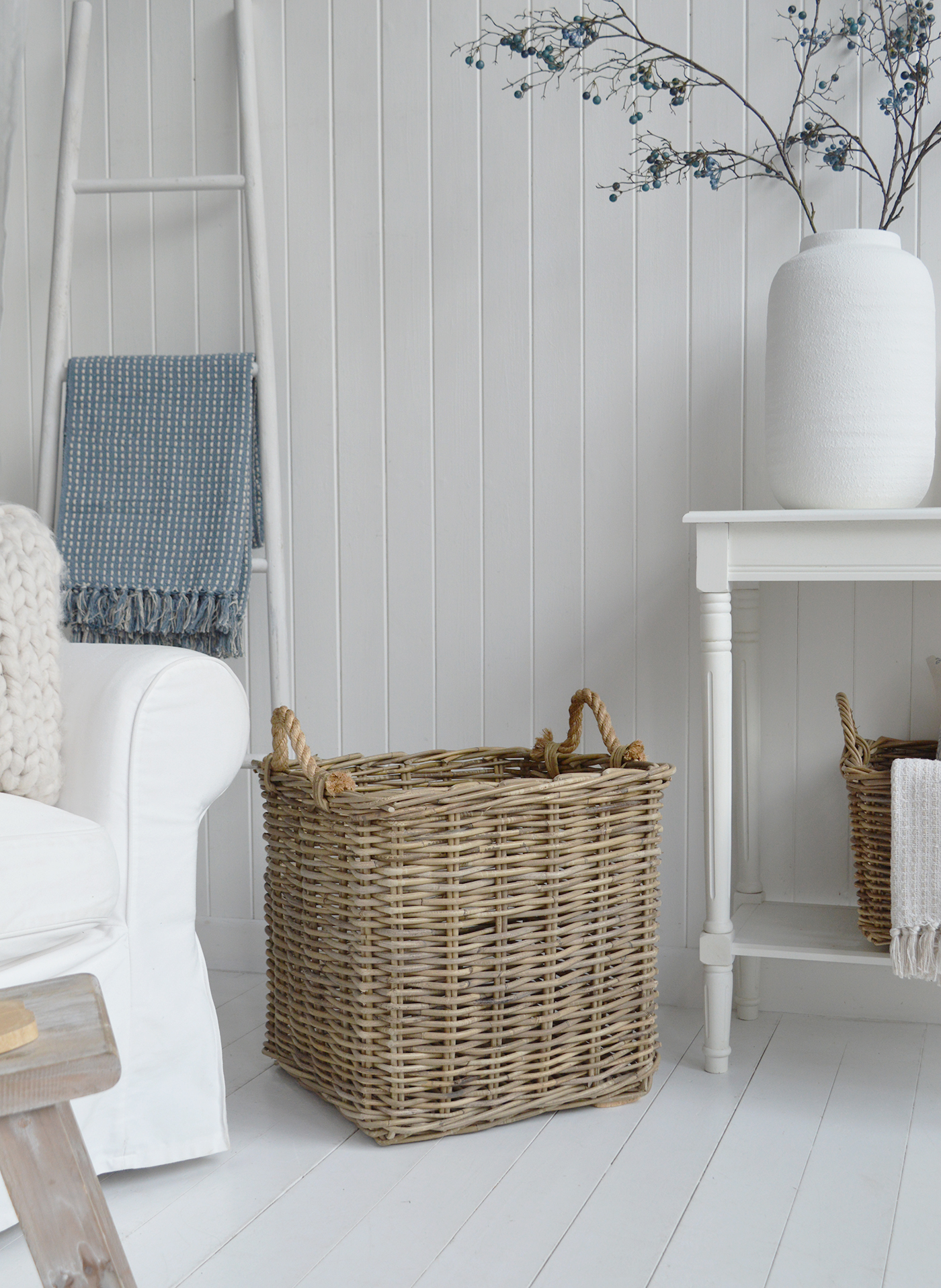 Sturdy rope handles give this coastal storage basket a distinctive nautical-inspired finish