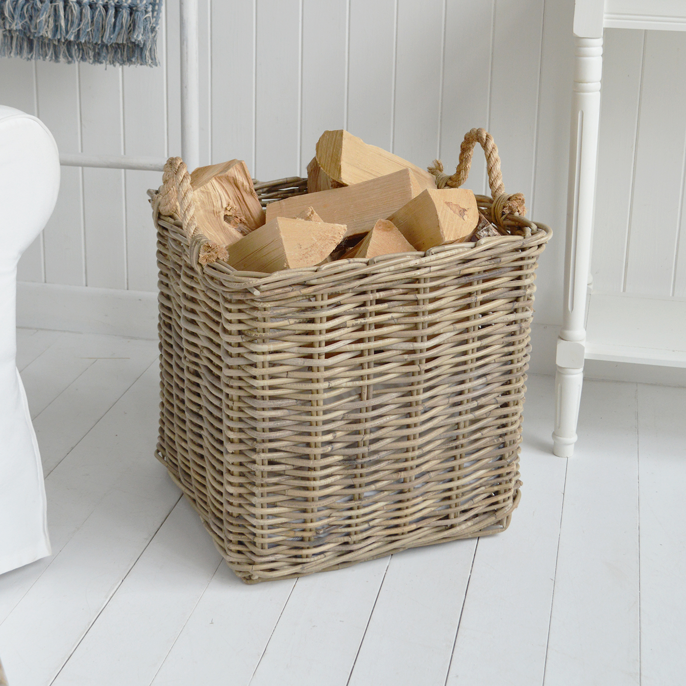 The Casco Bay log basket combines natural woven texture with chunky rope handles for relaxed coastal interiors.