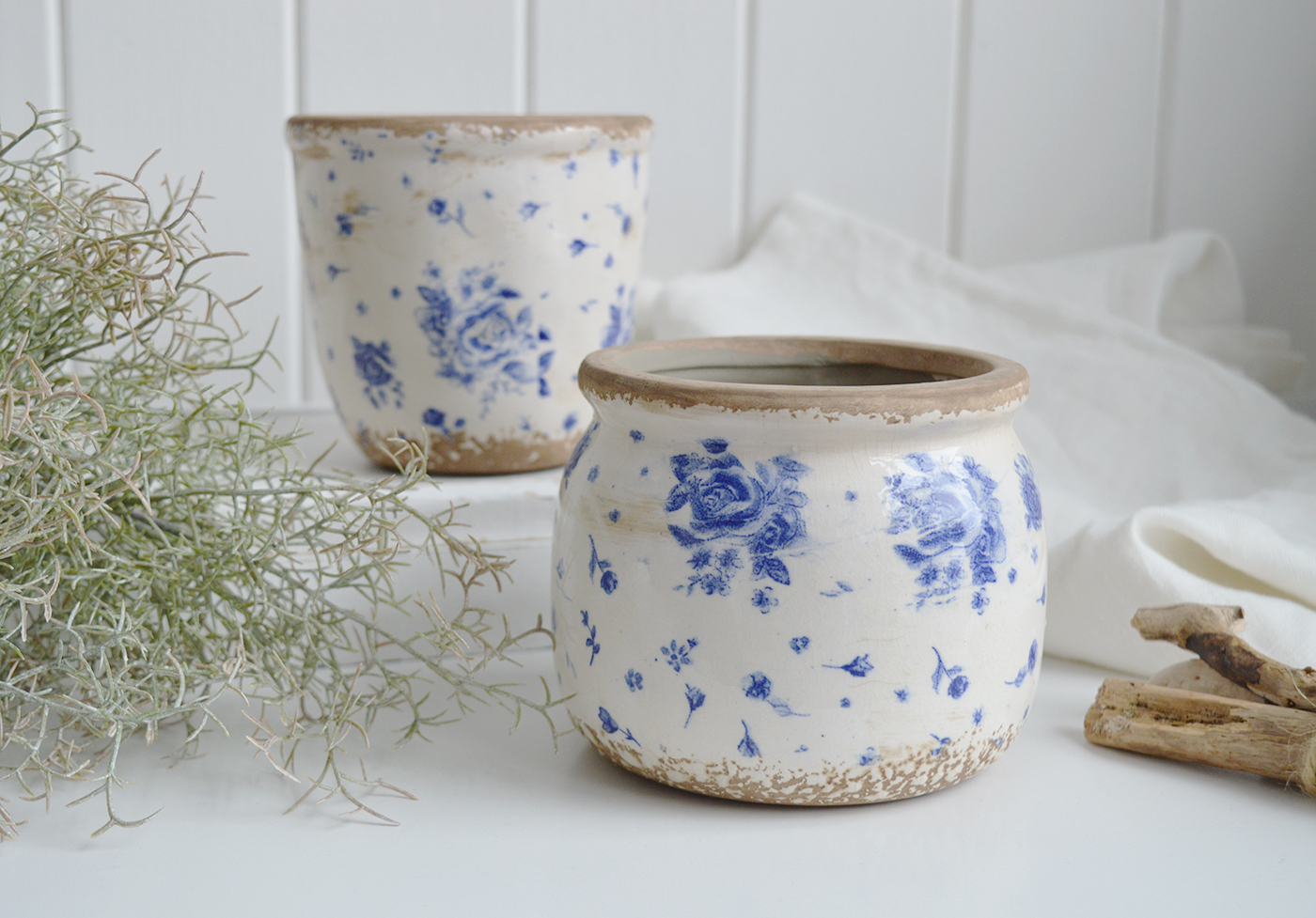 Vintage Blue Rose ceramic crock with wide rounded body and faded cobalt floral pattern in coastal New England style